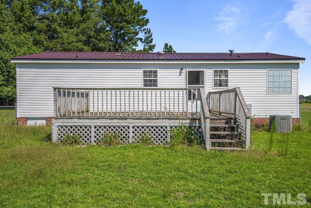 92 Wayland Drive St. Pauls, NC 28384 - Photo 25 of 36 a front view of a house with a garden