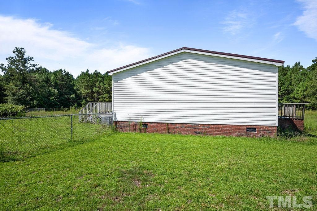 92 Wayland Drive St. Pauls, NC 28384 - Photo 26 of 36 a view of a backyard with a garden