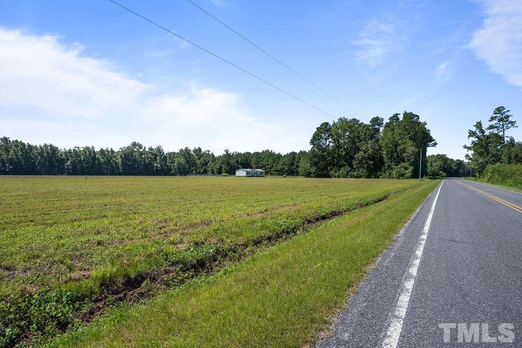 92 Wayland Drive St. Pauls, NC 28384 - Photo 27 of 36 a view of a lake with a big yard