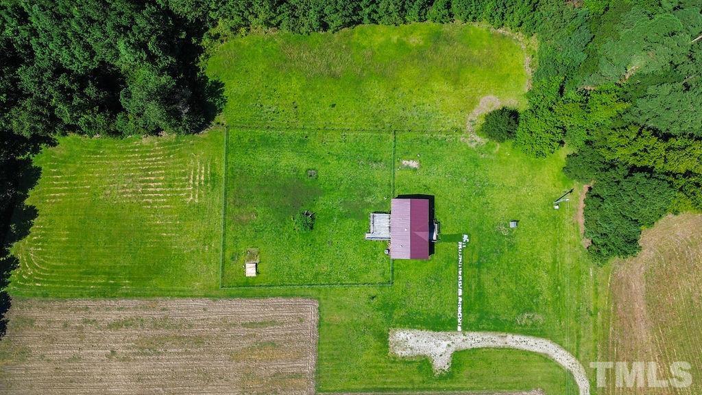 92 Wayland Drive St. Pauls, NC 28384 - Photo 30 of 36 a green field with lots of trees