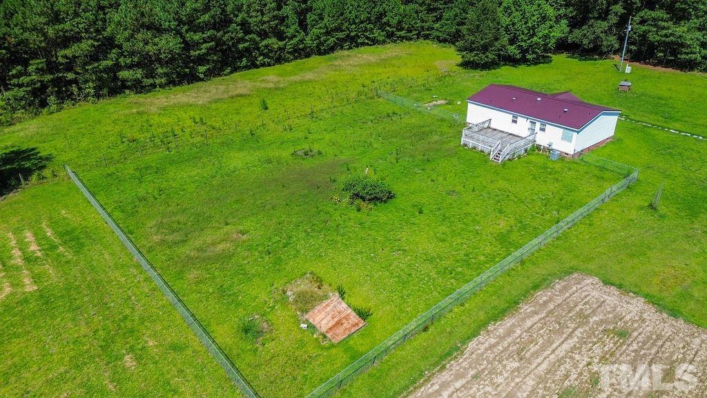 92 Wayland Drive St. Pauls, NC 28384 - Photo 35 of 36 a green field with some trees