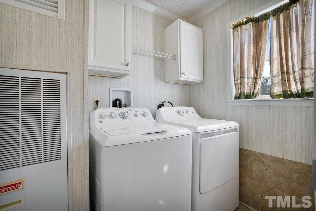 92 Wayland Drive St. Pauls, NC 28384 - Photo 9 of 36 a utility room with dryer and washer