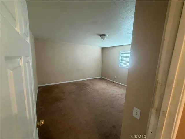 a view of room with window and hardwood floor