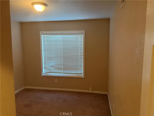 an empty room with a empty space and window