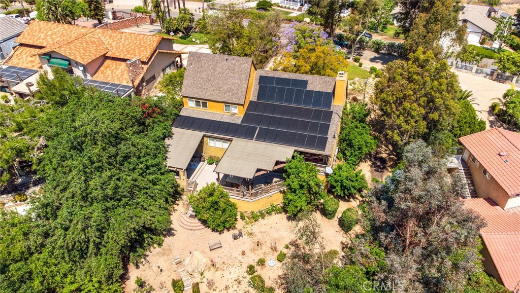 7241 Old Temescal Road Corona, CA 92881 - Photo 38 of 47 an aerial view of a house with a yard and large trees
