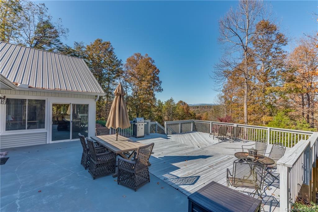 1020 Mountain Creek Road Rutherfordton, NC 28139 - Photo 2 of 48 a view of a patio with couches table and chairs and potted plants