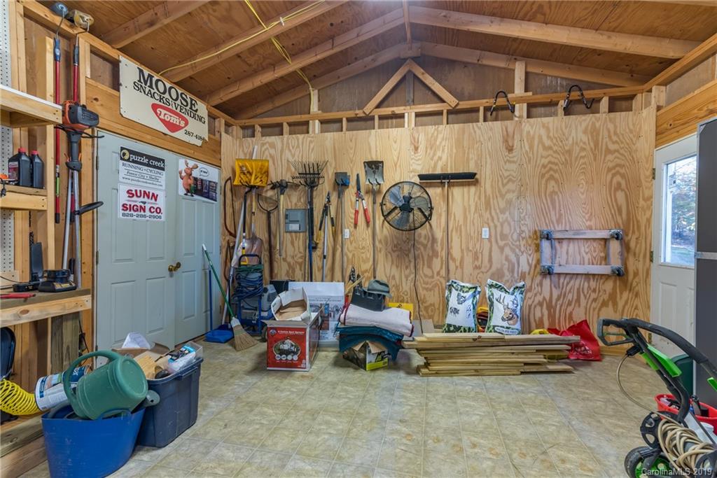 1020 Mountain Creek Road Rutherfordton, NC 28139 - Photo 12 of 48 a storage room with lots of clutter and furniture
