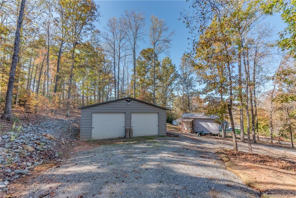 1020 Mountain Creek Road Rutherfordton, NC 28139 - Photo 13 of 48 a view of a house with a yard and garage