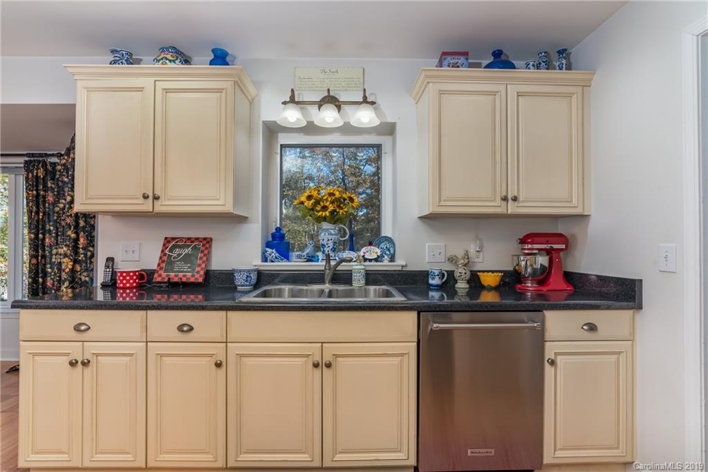 1020 Mountain Creek Road Rutherfordton, NC 28139 - Photo 24 of 48 a kitchen with white cabinets and sink