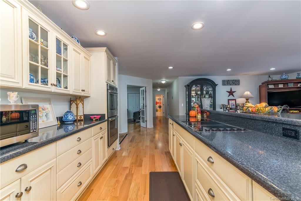 1020 Mountain Creek Road Rutherfordton, NC 28139 - Photo 25 of 48 a large kitchen with stainless steel appliances granite countertop a large counter top and a stove