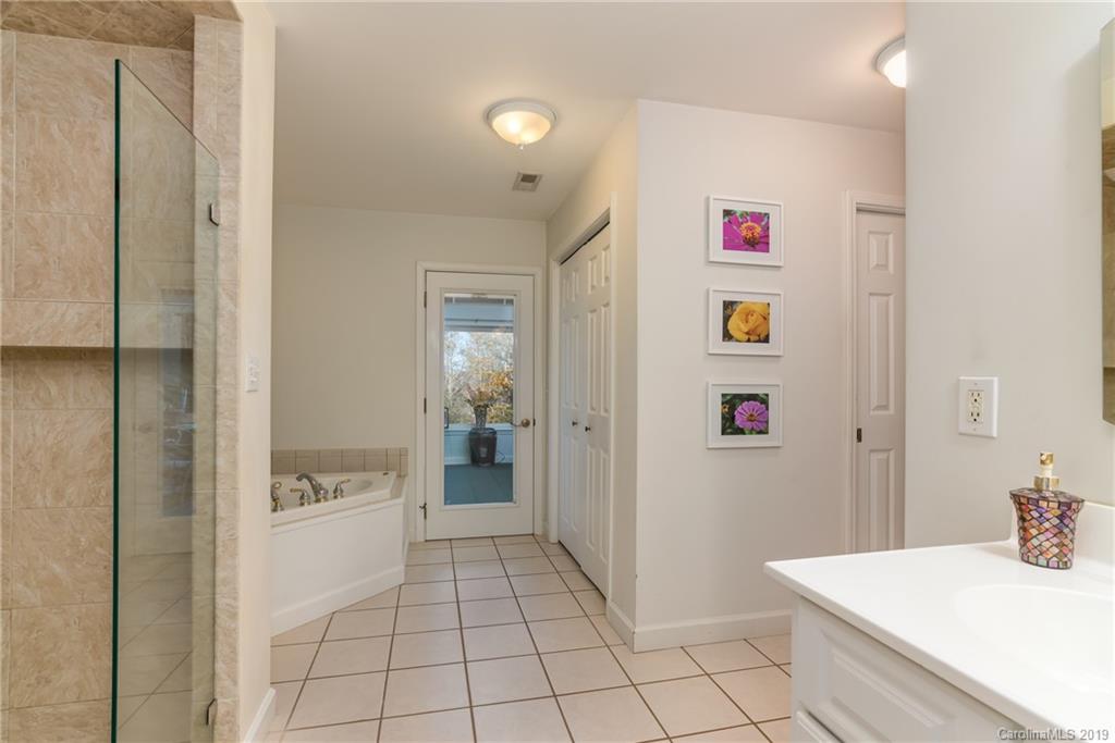 1020 Mountain Creek Road Rutherfordton, NC 28139 - Photo 42 of 48 a bathroom with a sink and a mirror