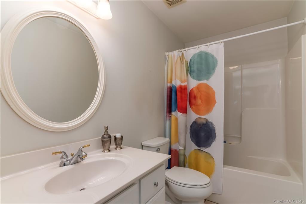 1020 Mountain Creek Road Rutherfordton, NC 28139 - Photo 45 of 48 a bathroom with a toilet a sink and a mirror