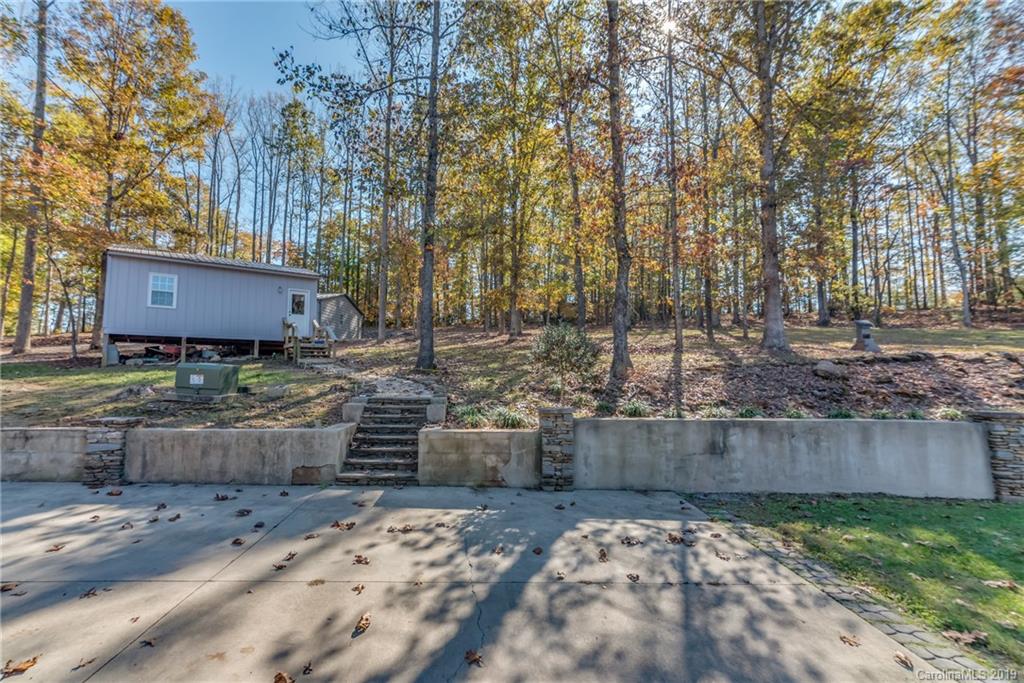 1020 Mountain Creek Road Rutherfordton, NC 28139 - Photo 6 of 48 a view of a backyard with plants and trees