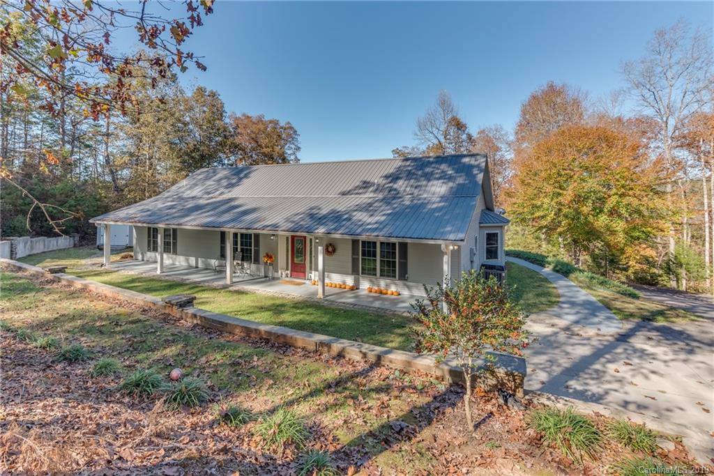 1020 Mountain Creek Road Rutherfordton, NC 28139 - Photo 10 of 48 a front view of a house with garden