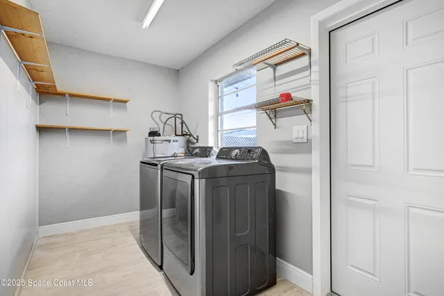 a utility room with dryer and washer