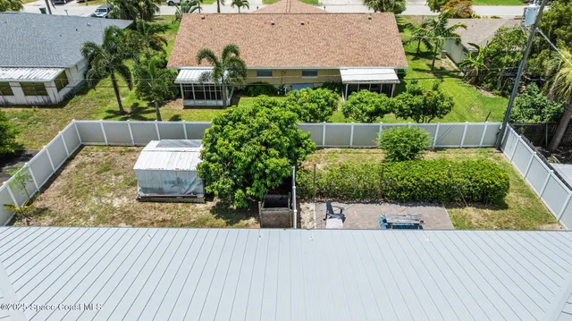 an aerial view of a house having patio