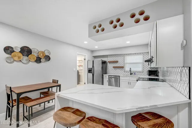a kitchen with cabinets and appliances