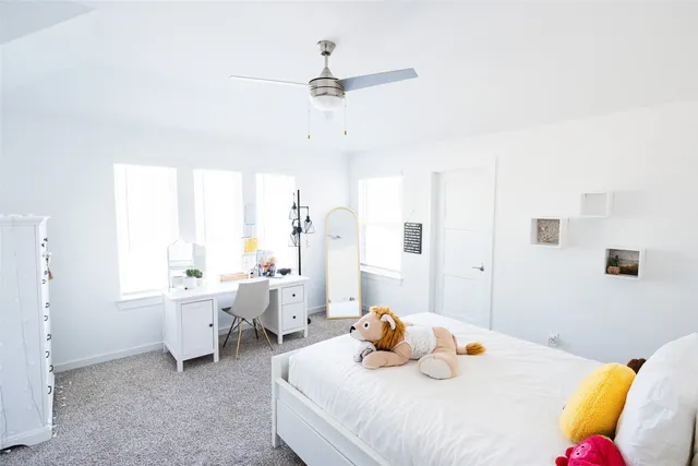 a bedroom with furniture and a large bed