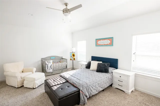 a bedroom with a bed and a couch