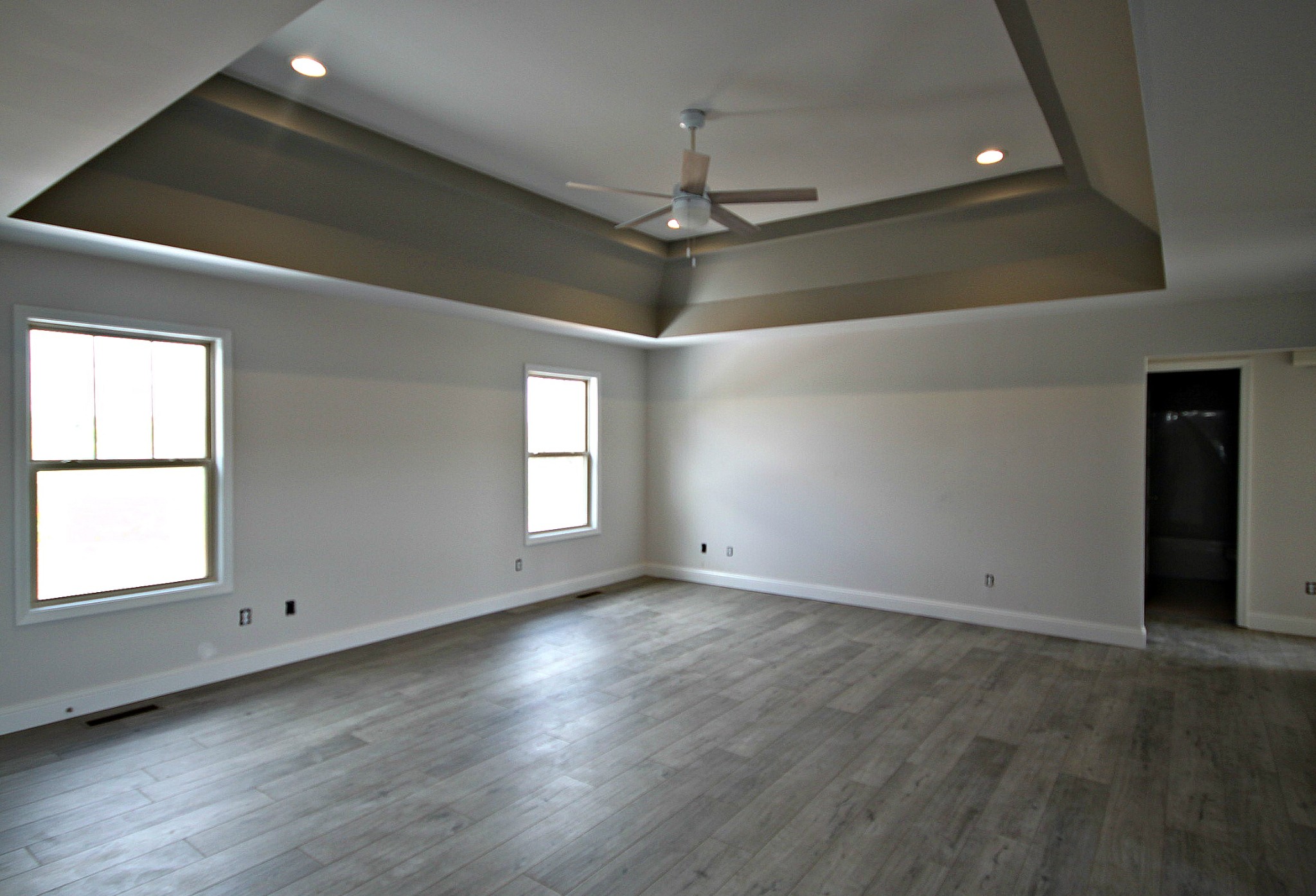 4112 Dot Road Springfield, TN 37172 - Photo 6 of 15 an empty room with wooden floor cabinet and windows
