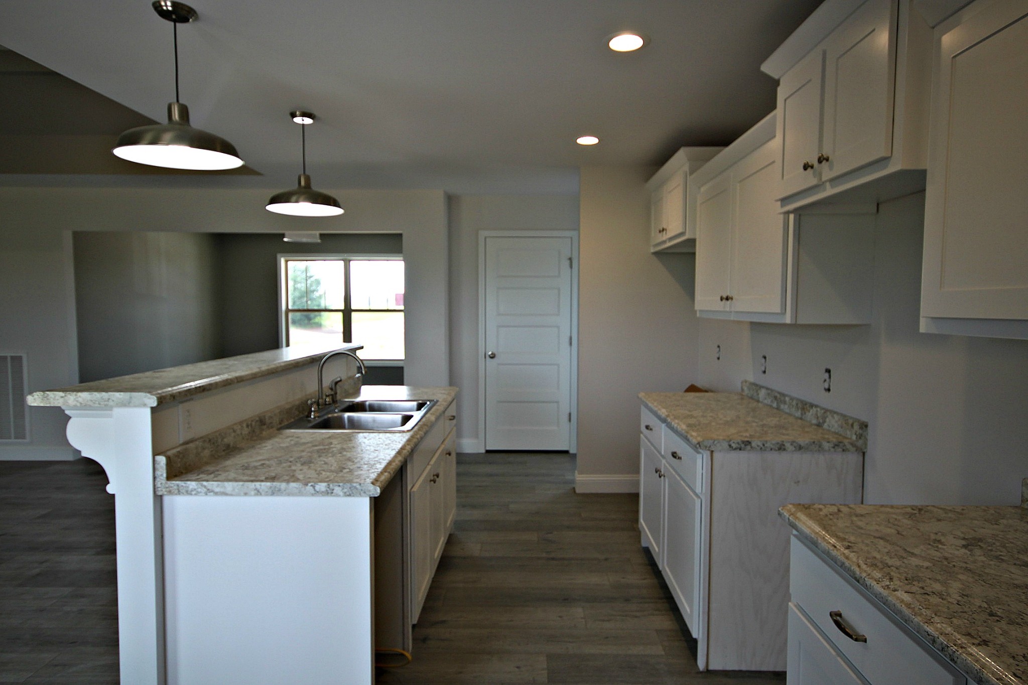 4112 Dot Road Springfield, TN 37172 - Photo 7 of 15 a kitchen with granite countertop kitchen island a stove and a sink