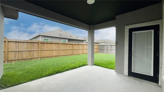 a view of a backyard of the house