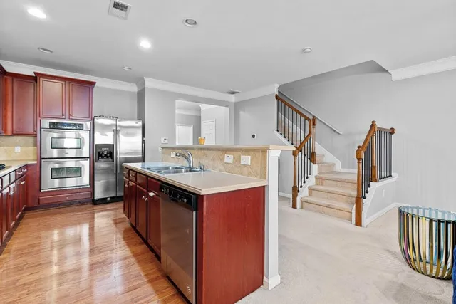 a kitchen with counter top space cabinets and stainless steel appliances