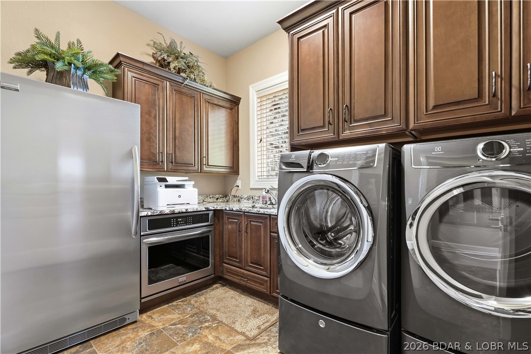 1015 Anemone Road Lake Ozark, MO 65049 - Photo 28 of 100 Main laundry with additional refrigertor and addit