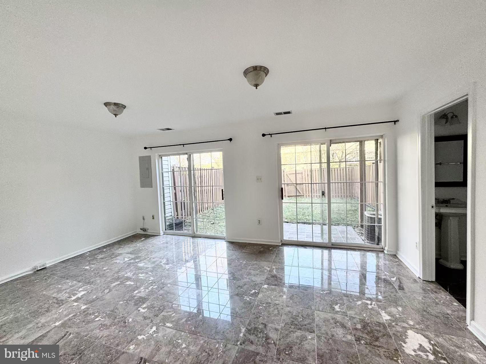 21764 Goose Cross Terrace Ashburn, VA 20147 - Photo 17 of 21 a view of an empty room with glass door