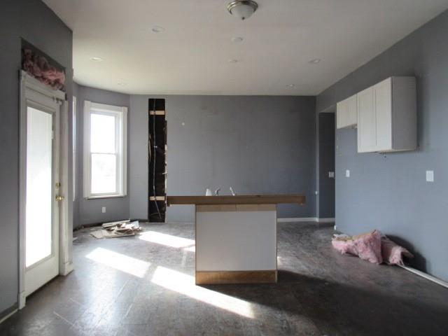 25 Ben Lomond Street Uniontown, PA 15401 - Photo 14 of 24 a living room with granite countertop furniture and a fireplace
