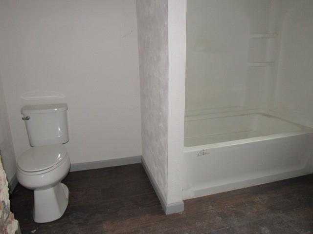 25 Ben Lomond Street Uniontown, PA 15401 - Photo 6 of 24 a bathroom with a toilet and a bathtub