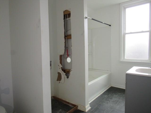 25 Ben Lomond Street Uniontown, PA 15401 - Photo 9 of 24 a bathroom with a tub and a shower