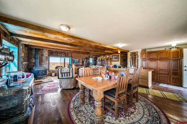 a outdoor dining space with furniture and rug