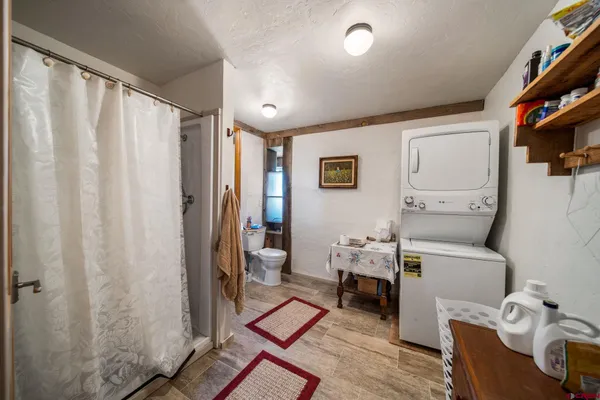 a living room with furniture a rug and a window