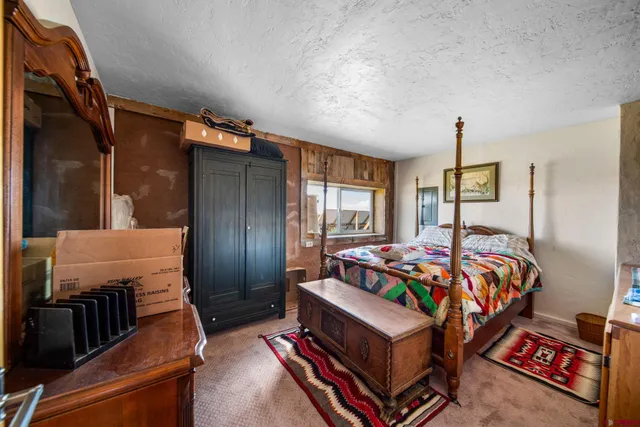 a bed room with bed and window