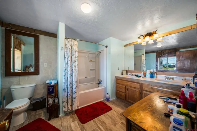 a kitchen with a sink appliances and cabinets