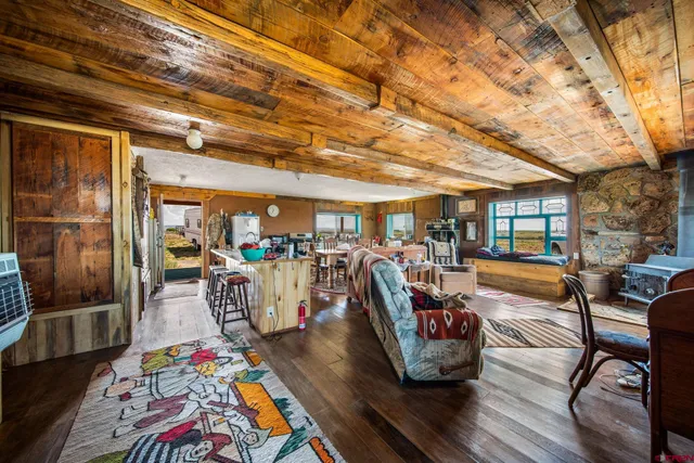 a living room with lots of furniture and gym equipment