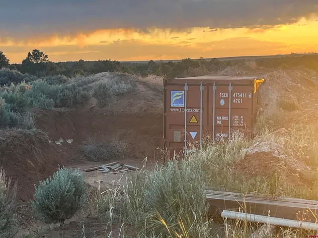 an aerial view of house with yard and mountain view