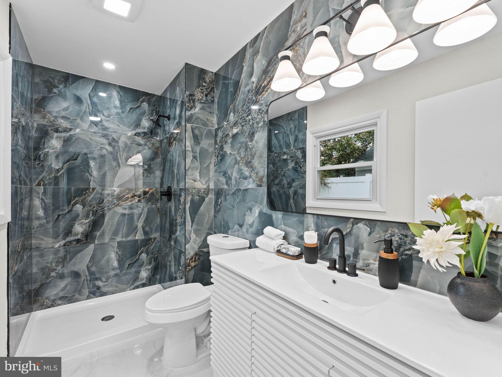 50 Tweedstone Lane Willingboro, NJ 08046 - Photo 21 of 45 a bathroom with a sink a toilet and shower