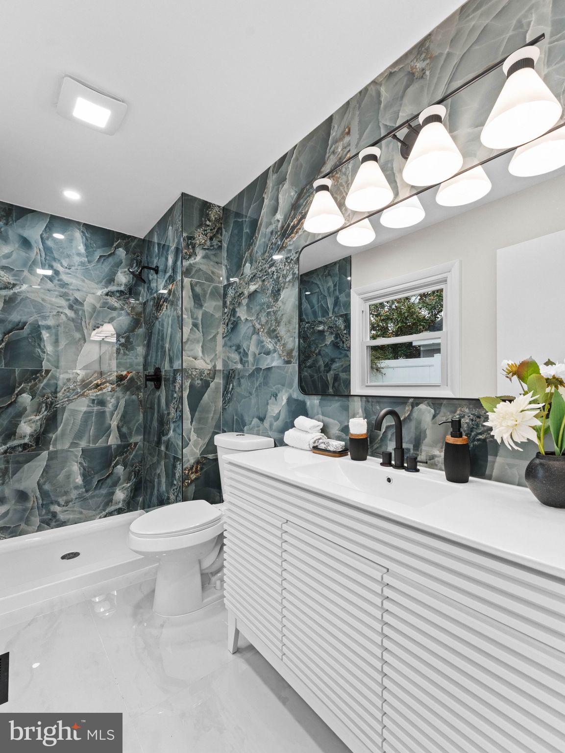 50 Tweedstone Lane Willingboro, NJ 08046 - Photo 22 of 45 a bathroom with a sink a toilet and mirror