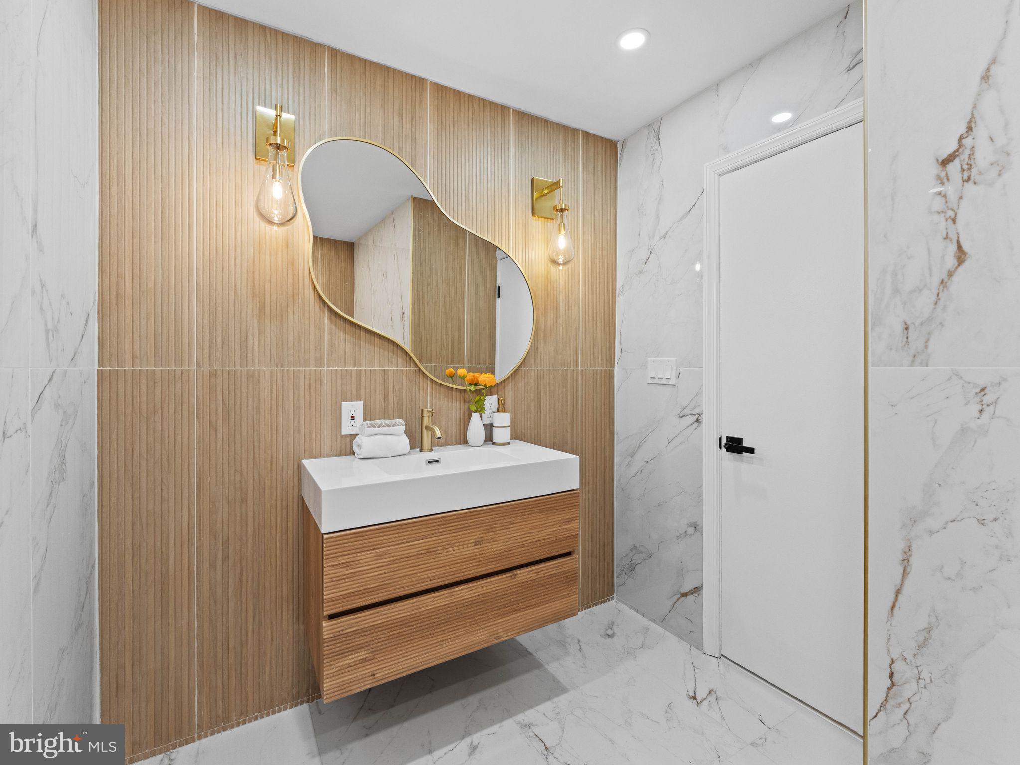 50 Tweedstone Lane Willingboro, NJ 08046 - Photo 25 of 45 a spacious bathroom with a sink and a mirror