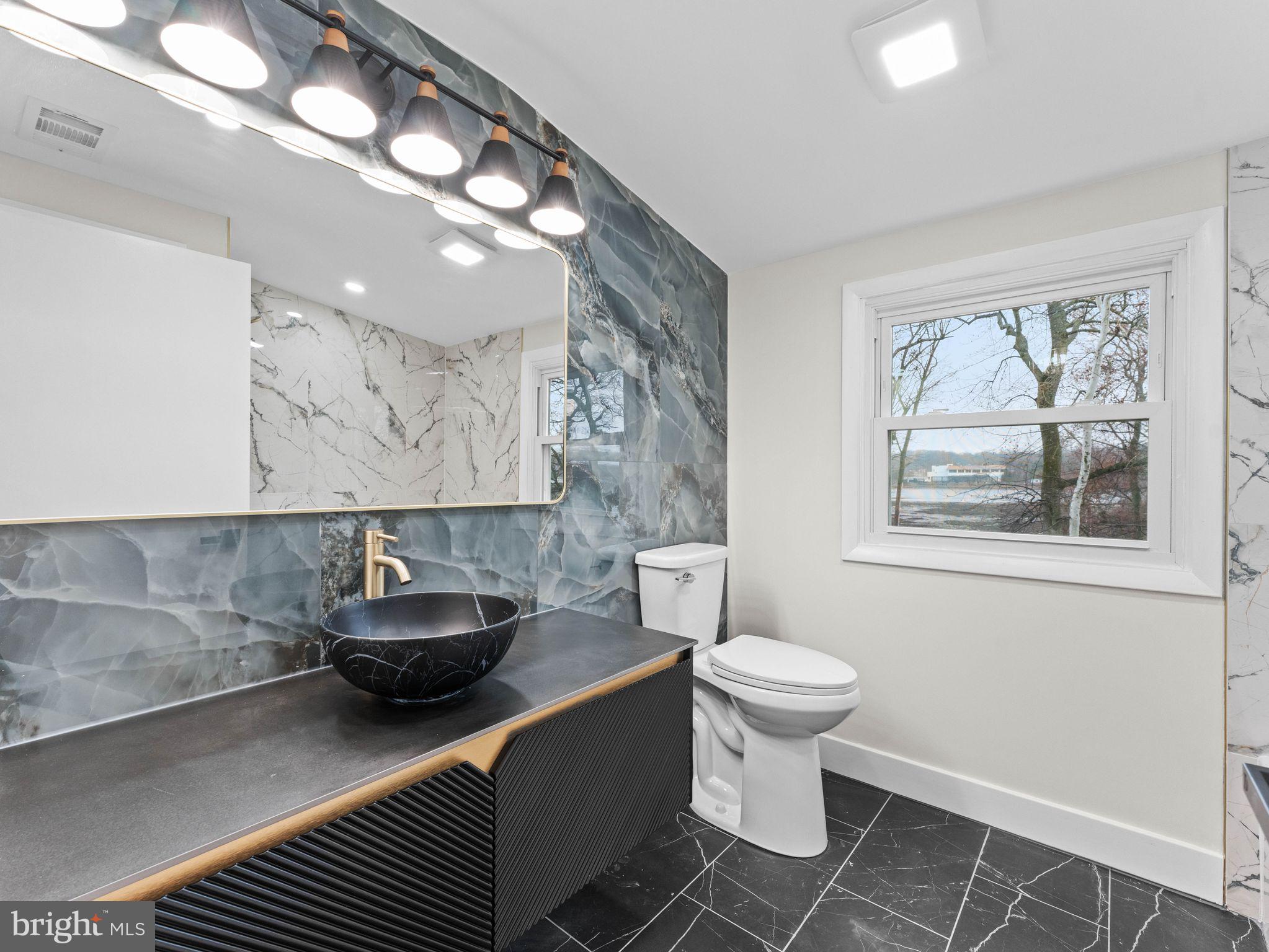 50 Tweedstone Lane Willingboro, NJ 08046 - Photo 33 of 45 a bathroom with a sink and a toilet