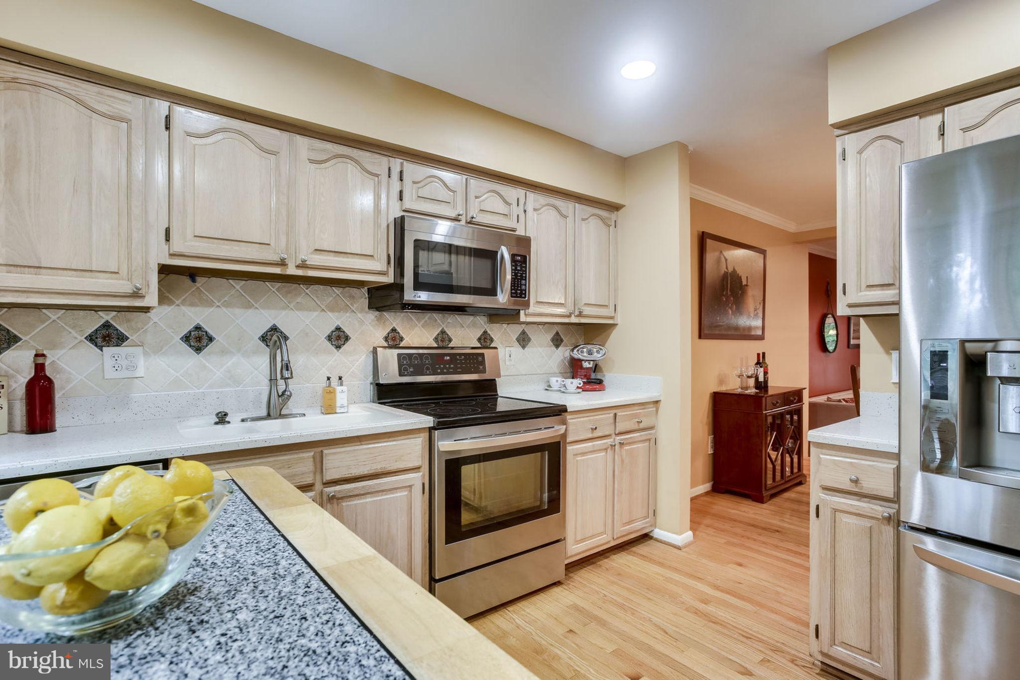 1447 Newport Spring Court Reston, VA 20194 - Photo 6 of 29 Hardwood floors - ice maker in door