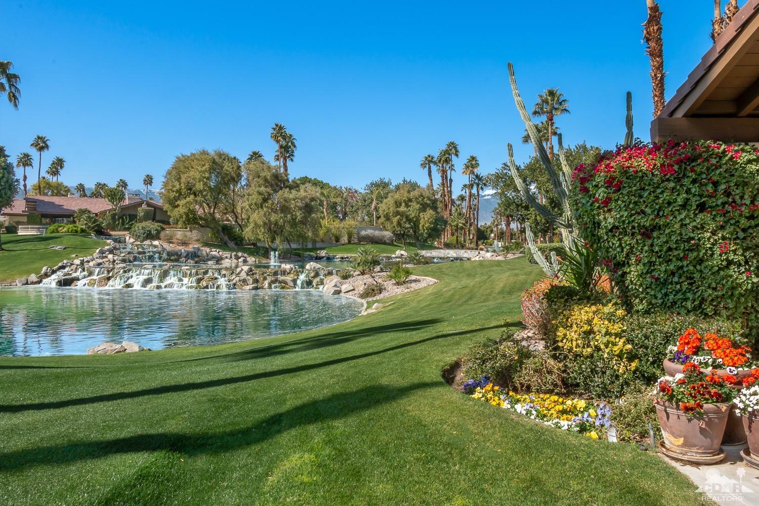 353 Red River Road Palm Desert, CA 92211 - Photo 1 of 28 a garden view with a lake view