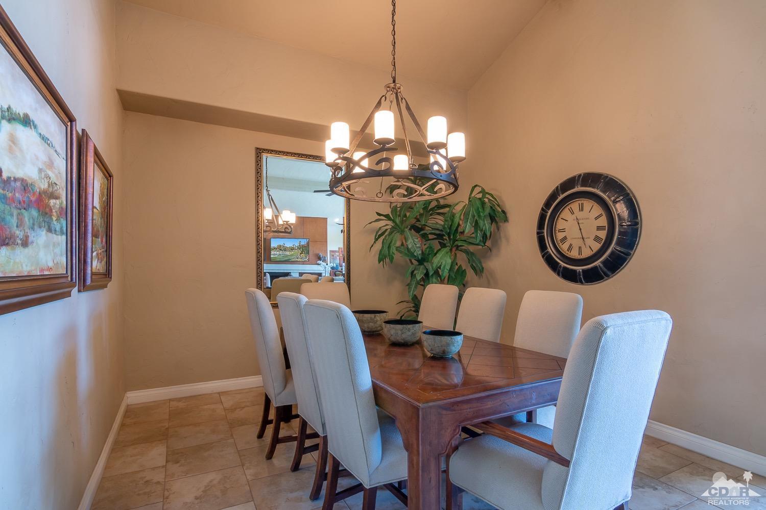 353 Red River Road Palm Desert, CA 92211 - Photo 13 of 28 a view of a dining room with furniture and a chandelier