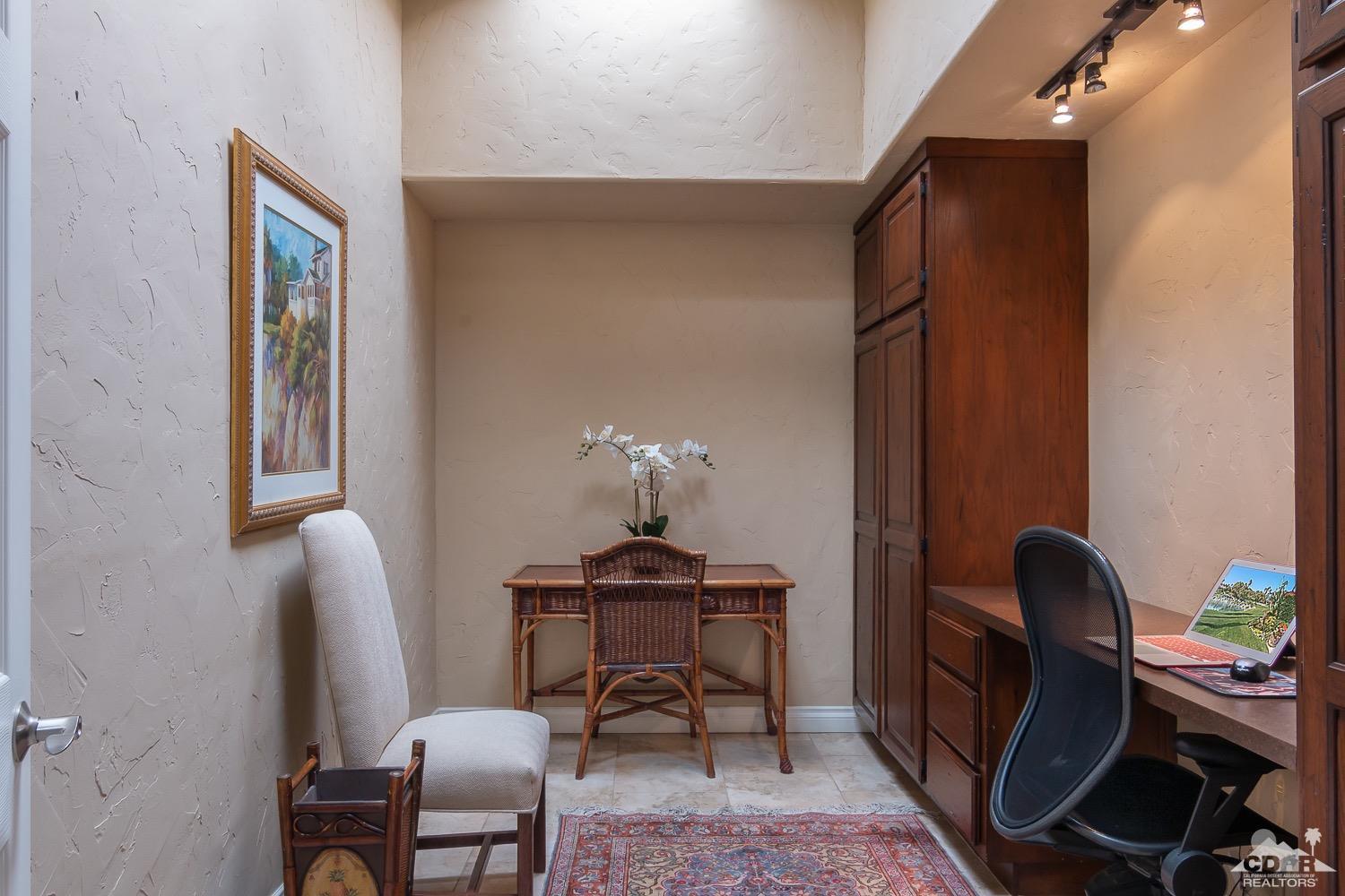 353 Red River Road Palm Desert, CA 92211 - Photo 15 of 28 a view of a workspace with furniture and a window