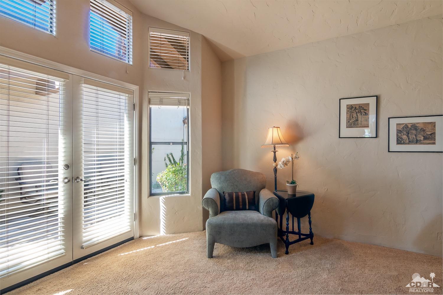 353 Red River Road Palm Desert, CA 92211 - Photo 22 of 28 a living room with furniture and a window
