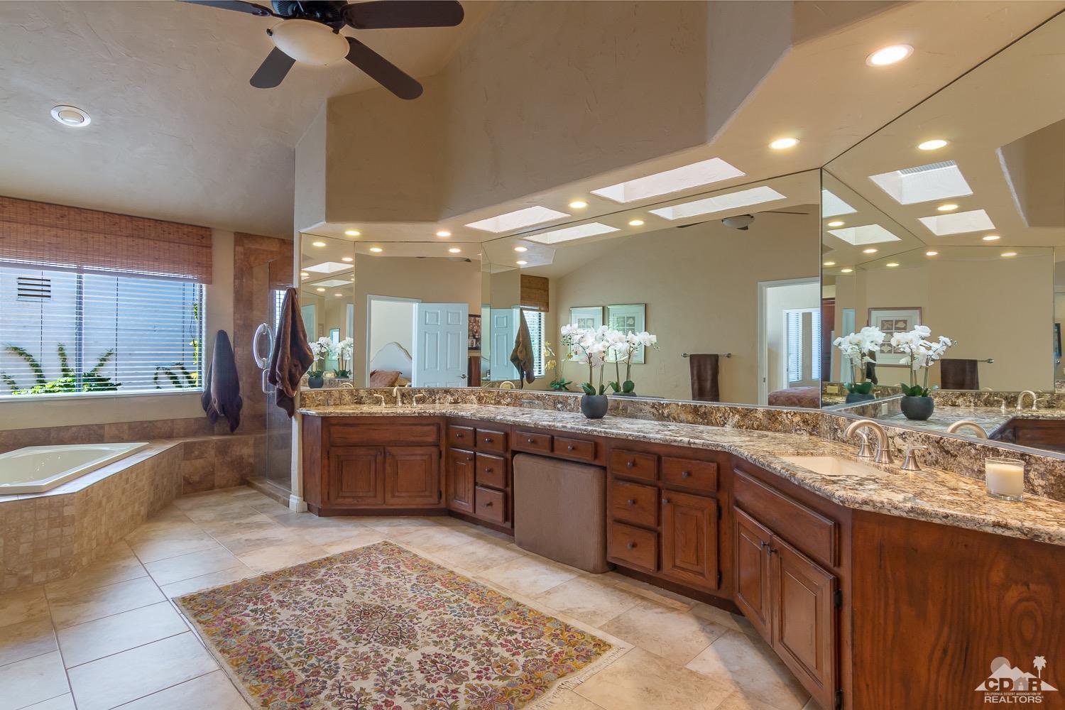 353 Red River Road Palm Desert, CA 92211 - Photo 23 of 28 a large bathroom with a large tub and sink