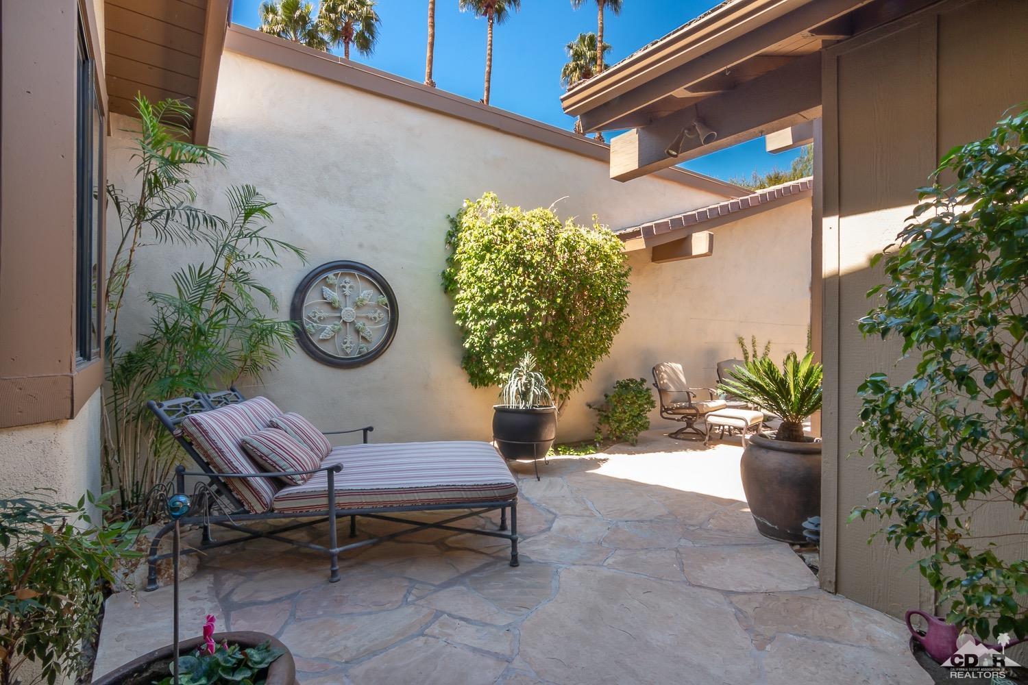 353 Red River Road Palm Desert, CA 92211 - Photo 24 of 28 a view of a bench in patio of the house