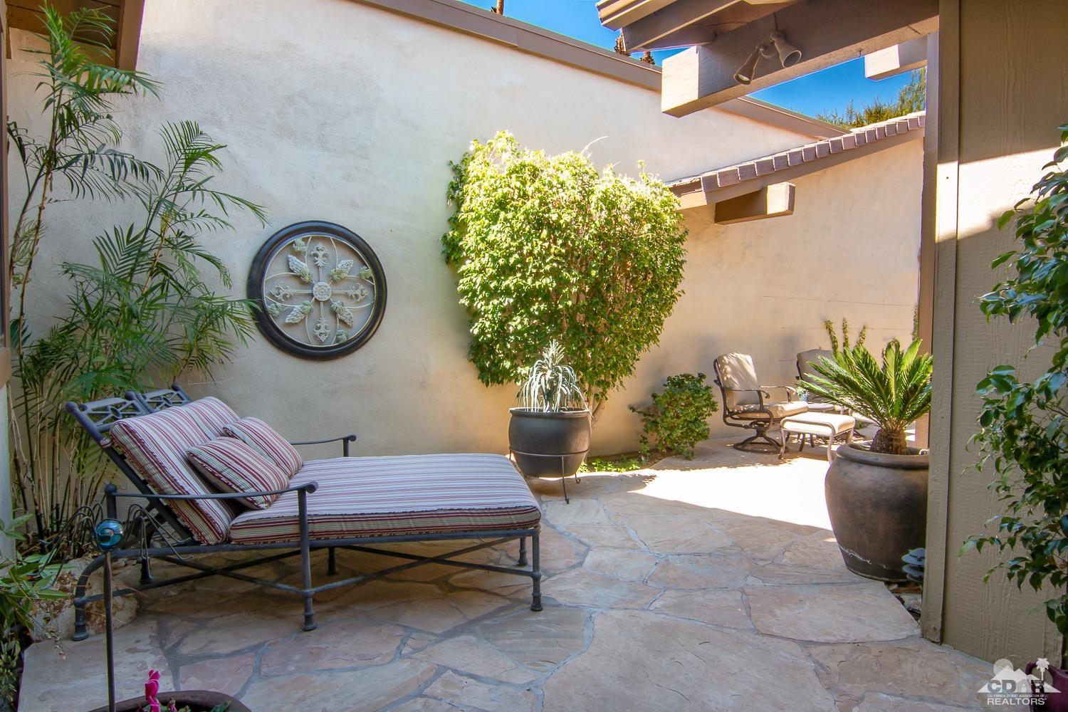 353 Red River Road Palm Desert, CA 92211 - Photo 25 of 28 a view of a bench in a patio